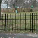 black aluminum picket fence around backyard