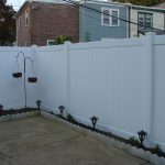 white fence with total privacy and walk lights