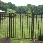 bronze fence with circle design