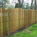 high wooden fence