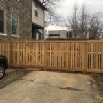 custom paneled wooden fence enclosure