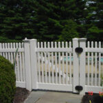 white vinyl fence around pool
