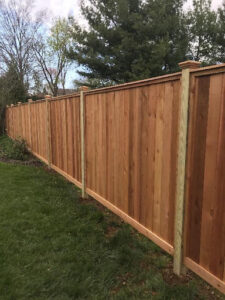 wooden privacy fence build around pool