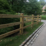 wooden split rail fence around house