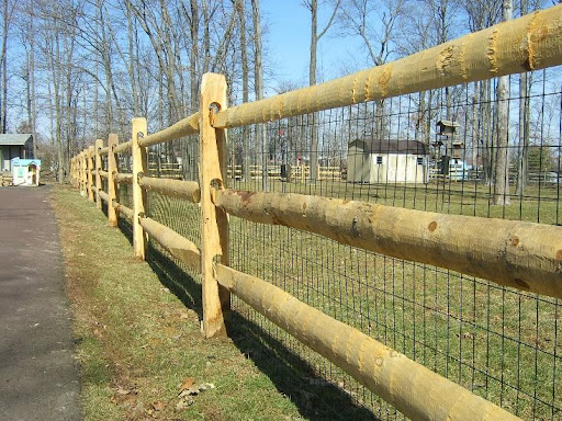 wooden split rail fence on driveway