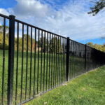 black aluminum fence in yard