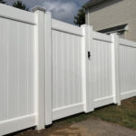 white vinyl fence with gate